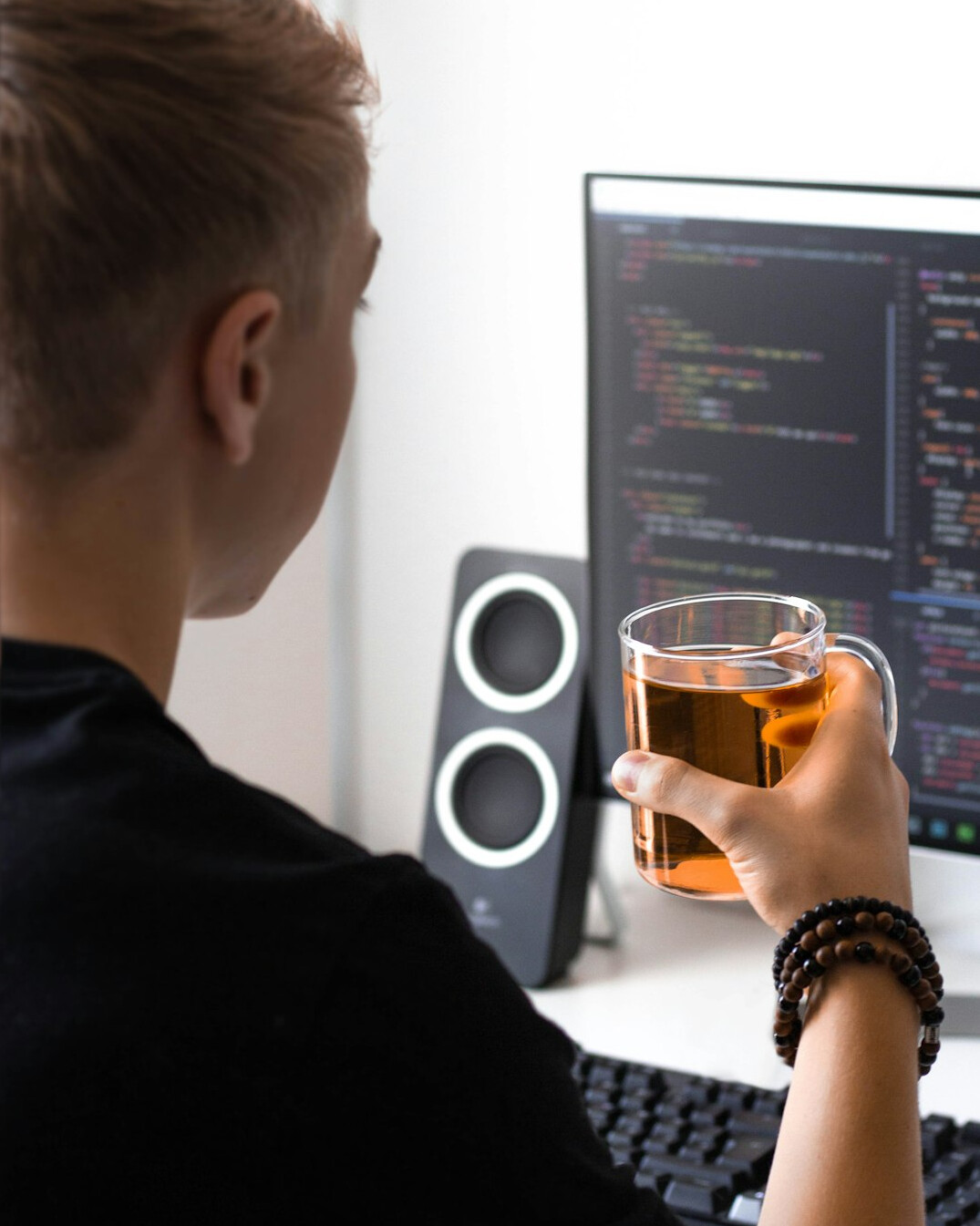 programmer coding at desk