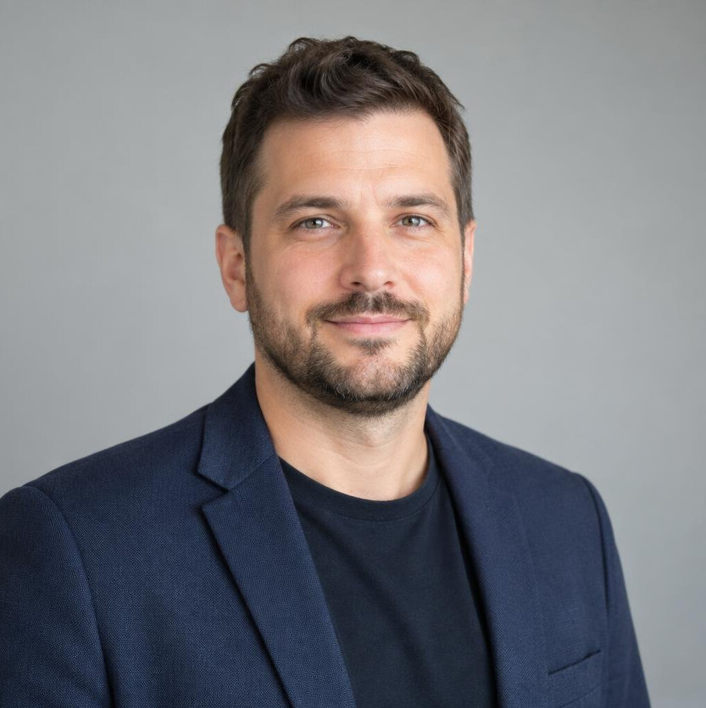 Bearded man in a neutral shirt portrait